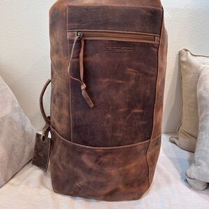 Vintage Brown Leather The J Peterman Co leather duffle bag.